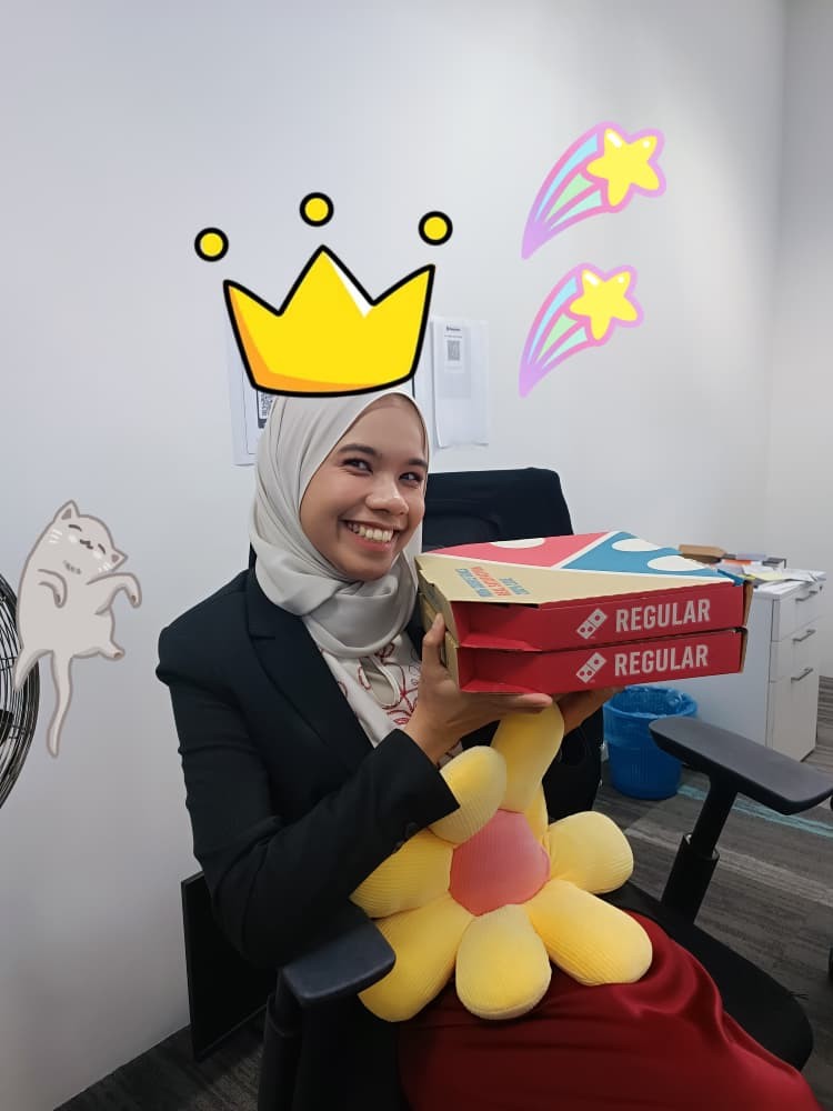 Birthday girl smiling with pizza